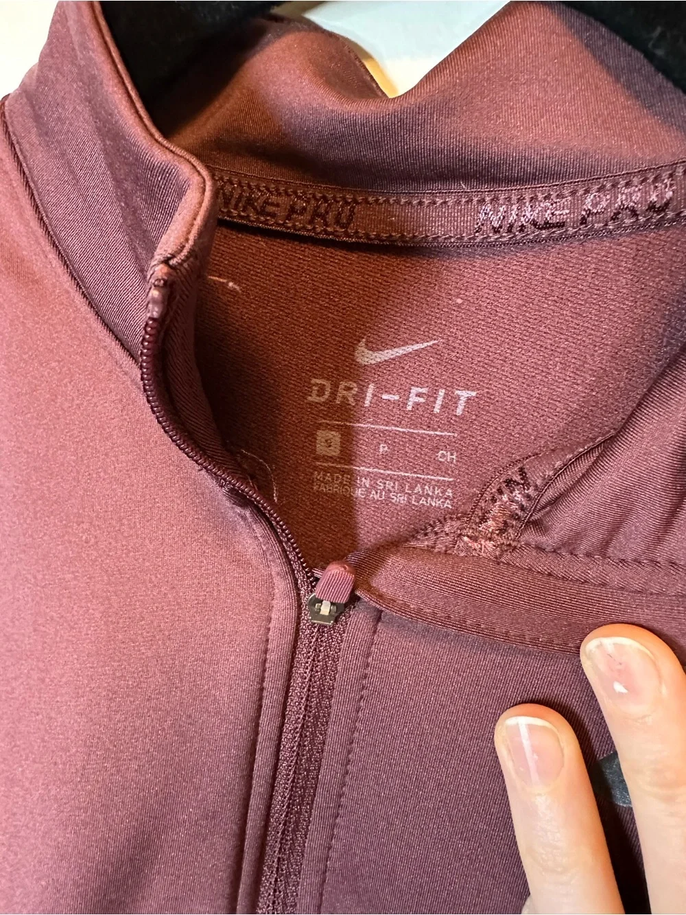 Nike Dri-FIT Cropped Zip Jacket in Burgundy